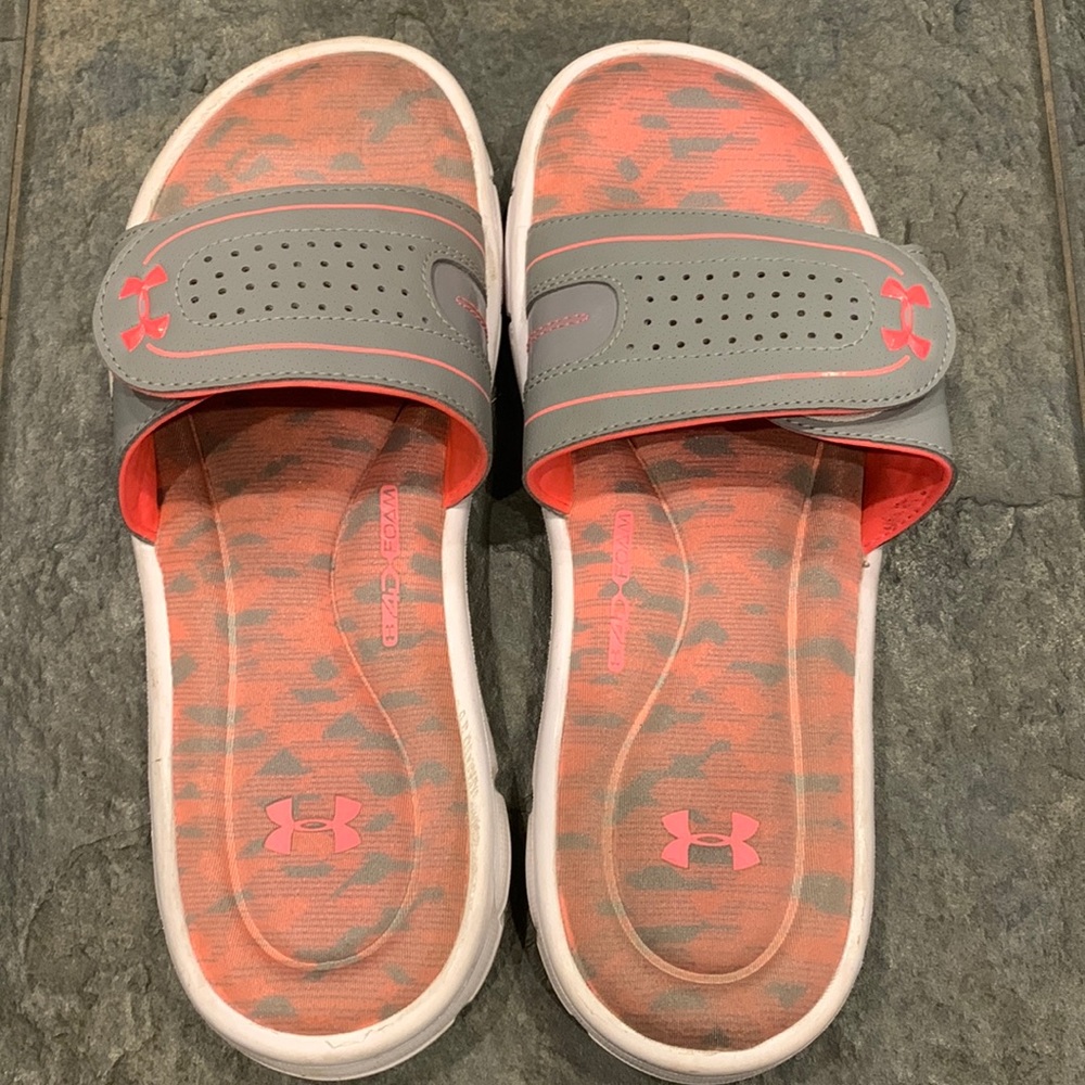 Gray and pink Under Armour women’s foam slides